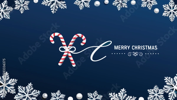 Fototapeta Festive merry christmas greeting card with crossed candy canes and snowflakes on a deep blue background