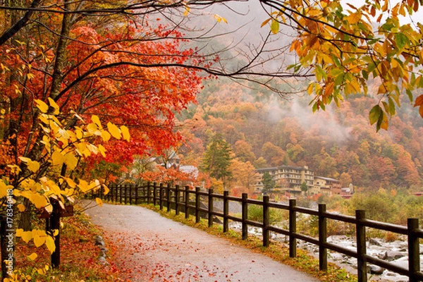 Obraz Autumn. Mountain hotel on the banks of the river.