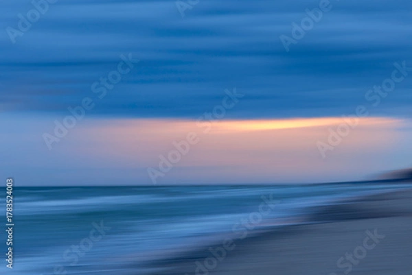 Fototapeta An early morning scenery before sunrise at the beach of Baltic Sea. Summer morning in Latvia, Europe.