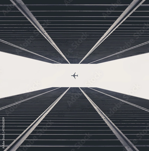 Obraz Plane between skyscrapers
