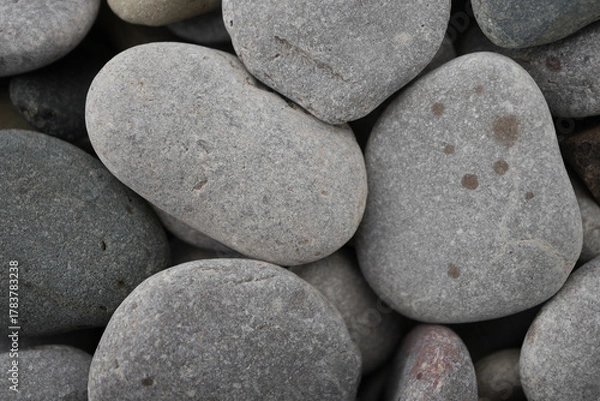 Obraz Close-up Of Smooth Grey And Reddish Pebbles And Rounded Stones On A Beach In Towyn, North Wales, Uk