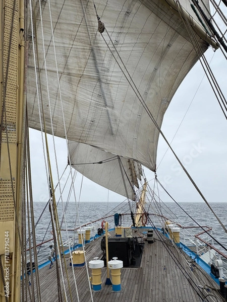 Fototapeta at sea under sail on a tall ship