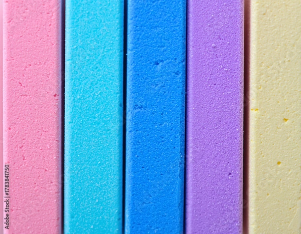 Fototapeta Color Spectrum: A vibrant collection of colorful chalk sticks, arranged side by side. Each stick displays a unique hue, showcasing the simplicity of a rainbow palette.