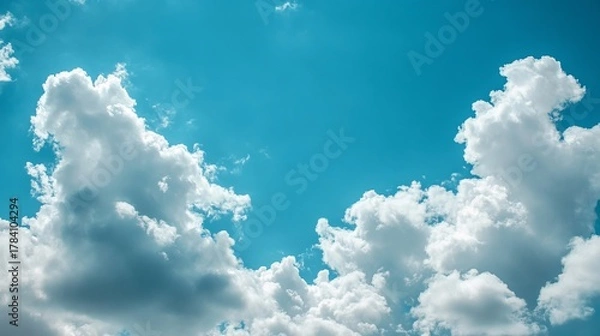 Fototapeta Bright sky filled with fluffy white clouds (1)