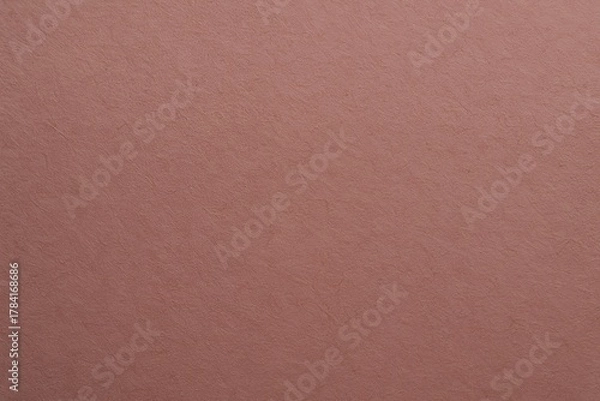 Fototapeta Beautifully textured rose gold paper background with subtle fibrous details, perfect for elegant design projects and sophisticated branding.