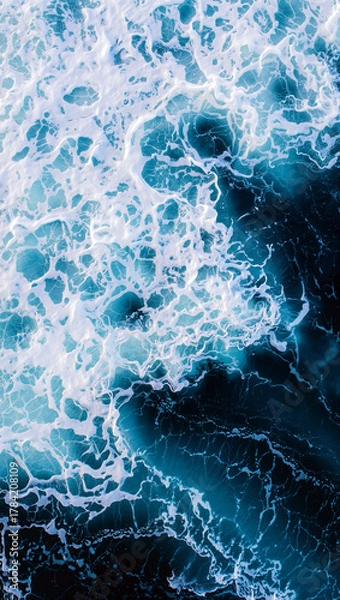 Fototapeta Vibrant waves crash against dark ocean water, creating dynamic patterns of white foam. The scene captures the beauty of nature during early morning hours. Generative AI.