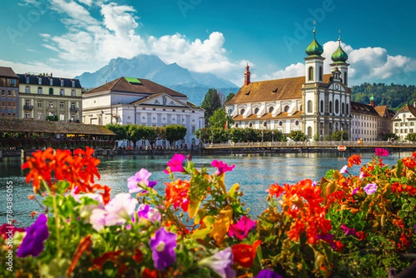 Fototapeta Flowery river side and picturesque waterfront buildings in Lucerne, Switzerland