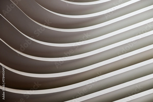 Fototapeta Part view of a built construction with curves, like abstract graphic background in black and white shapes