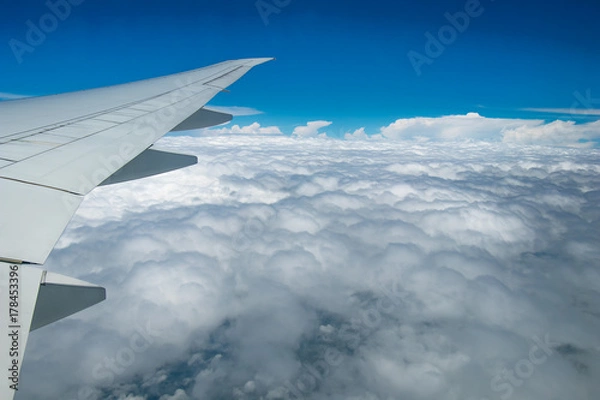 Fototapeta Flying through the clouds