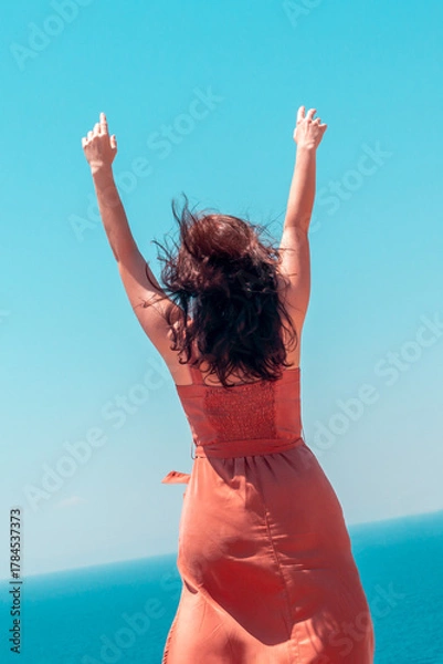 Fototapeta Girl is enjoying summer vacation at the turquoise sea