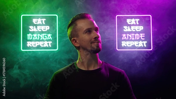 Obraz Male person look between two futuristic neon signs Eat Sleep Manga Repeat and Eat Sleep Anime Repeat