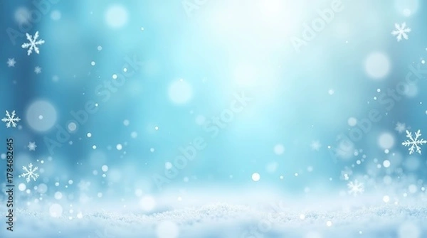 Fototapeta Winter background with falling snowflakes and snow ground in light blue color