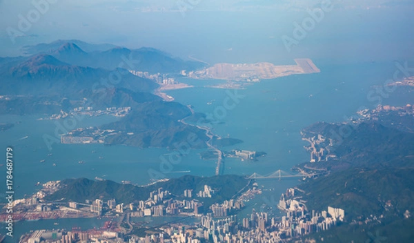 Fototapeta Panoramic aerial view of Hong Kong city, China. Flying above Hong Kong