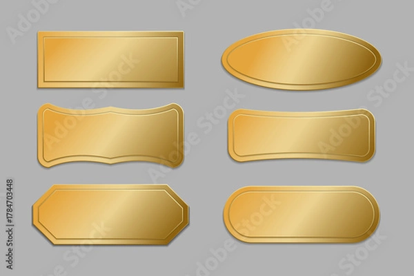Fototapeta A set of empty gold frames isolated on a gray background. VIP gold labels of premium class, high-quality stamps and stickers, collection. 
