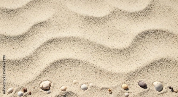 Fototapeta Sandy Serenity: A close-up perspective of undulating sand texture with a scattering of small pebbles, evoking a sense of tranquility and the rhythmic dance of nature.