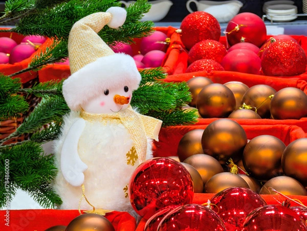 Obraz Snowman and Christmas tree decorations in a supermarket