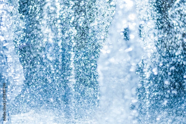 Fototapeta The gush of water of a fountain. Splash of water in the fountain, abstract image