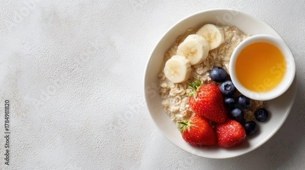 Obraz healthy breakfast flat lay with oatmeal, fruit, and vitamins