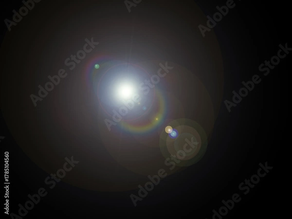 Obraz Bright Cinematic Lens Flare with Rainbow Spectrum Reflection on Black Background Realistic Optical Glow Light Effect