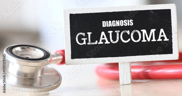 Fototapeta GLAUCOMA word on a small chalk board next to a stethoscope.