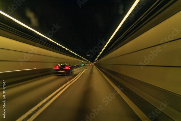 Fototapeta Driving through illuminated tunnel in South Sweden