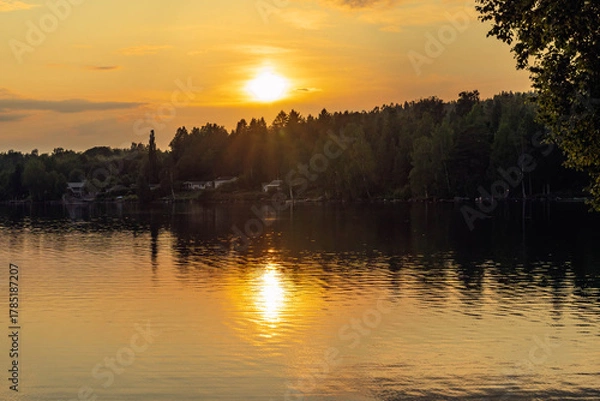 Obraz Reflecting sunset light on lake in Sweden
