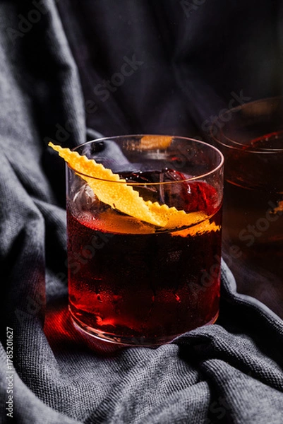 Obraz Red Negroni with black background. 