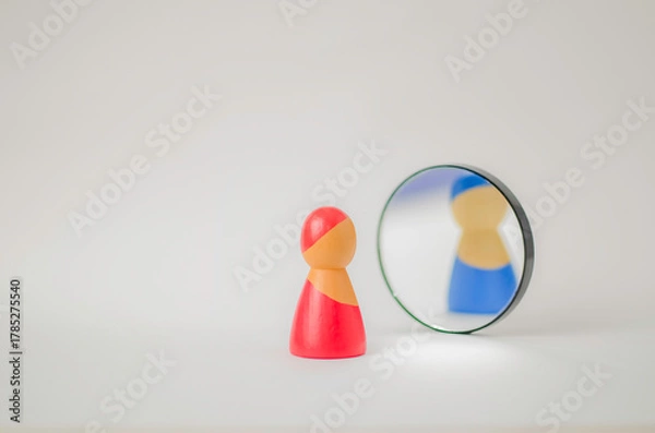 Obraz Figurine reflecting different gender identity in mirror