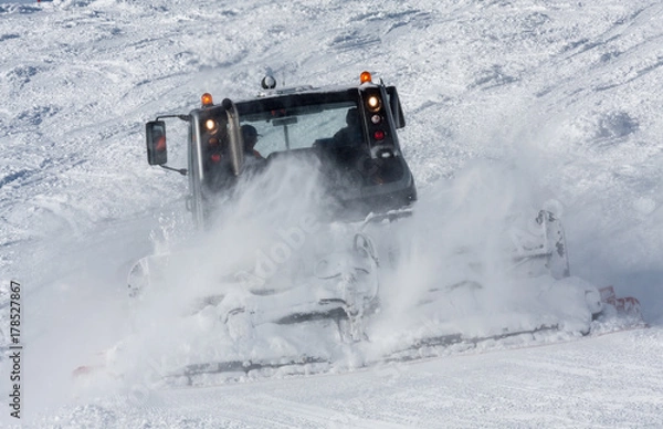 Fototapeta snow groomer in work