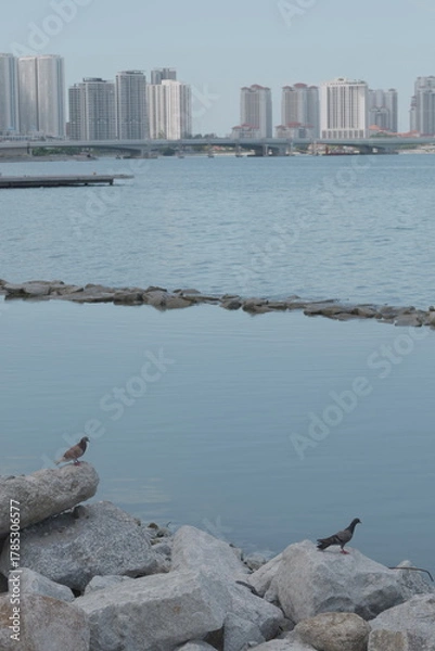 Fototapeta View of an ocean breakwater made by stacking big boulders on top of each other