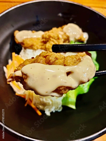 Fototapeta Close-up of Chicken Karaage Donburi with Sauce