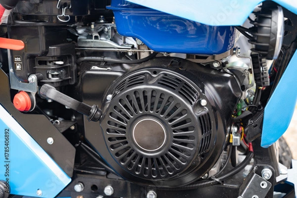 Fototapeta Close-up of an automotive alternator in an engine compartment.