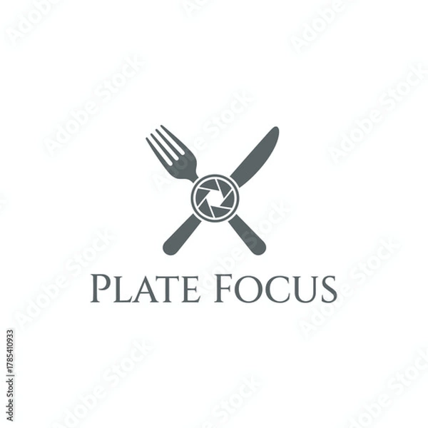 Fototapeta A logo featuring a fork and knife crossing, with a camera aperture in the center. Text below
