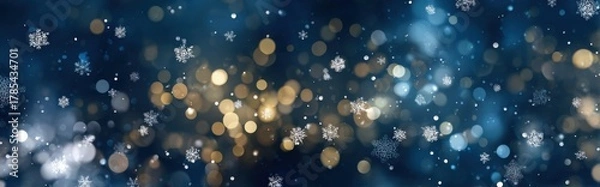 Fototapeta Deep navy winter background with white snowflakes, golden and blue bokeh lights, and soft glowing orbs. Festive, cozy tones blend for holiday, seasonal, or elegant design backdrops.

