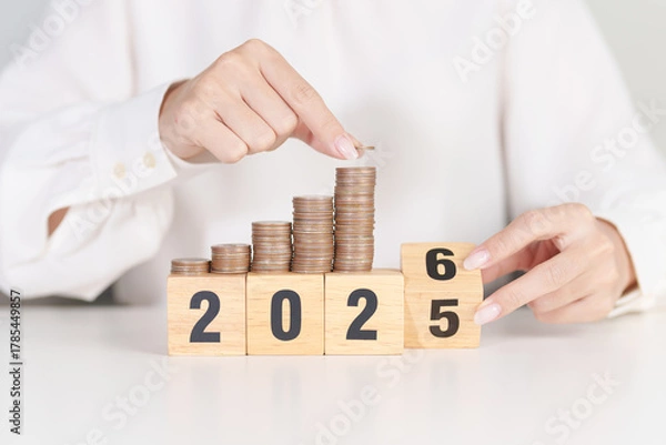 Fototapeta 2025 end year to Happy New Year 2026 with Coins stack. Money, Budget, tax, investment, financial, savings and New Year Resolution concepts