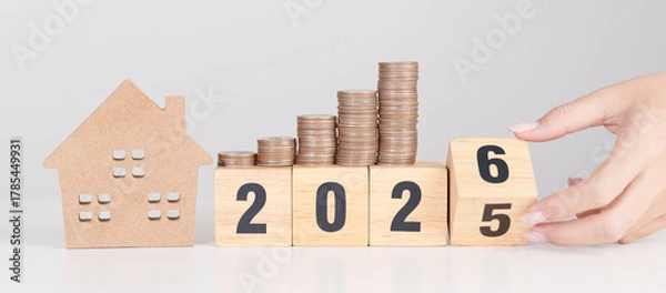 Obraz 2025 end year to Happy New Year 2026 with house model and Coins stack. real estate, Home loan, tax, investment, mortgage, financial, savings and New Year Resolution concepts