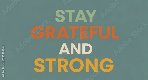 Fototapeta Inspirational quote graphic with the message 'Stay Grateful and Strong' in bold, colorful letters on a calming background to motivate positivity and resilience