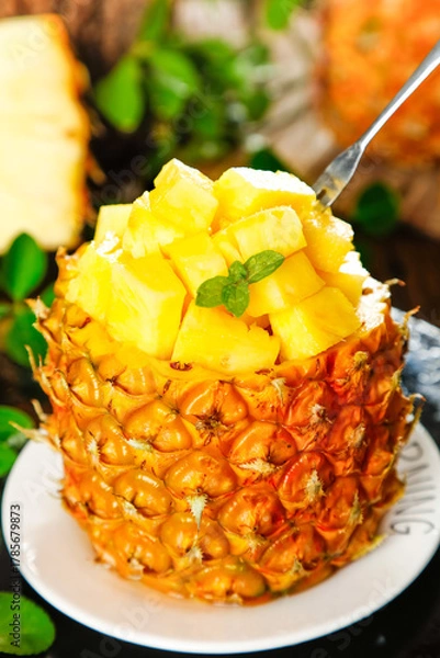 Obraz Sweet Xuwen Pineapple from Zhanjiang Hand-Torn Fresh Tropical Fruit Dessert with Mint Garnish