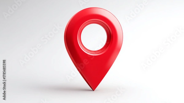 Fototapeta A red location pin standing on a white surface in a studio setting with shadows