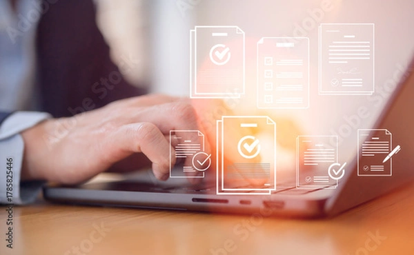 Fototapeta Businessman using laptop for digital document management corporate management approval concept, paperless workflow automation business process efficiency project authorization