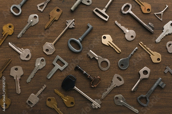 Fototapeta Many different keys on wood