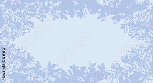 Fototapeta Here's a stock photo description for the image:

Winter Foliage Frame on Light Blue Background