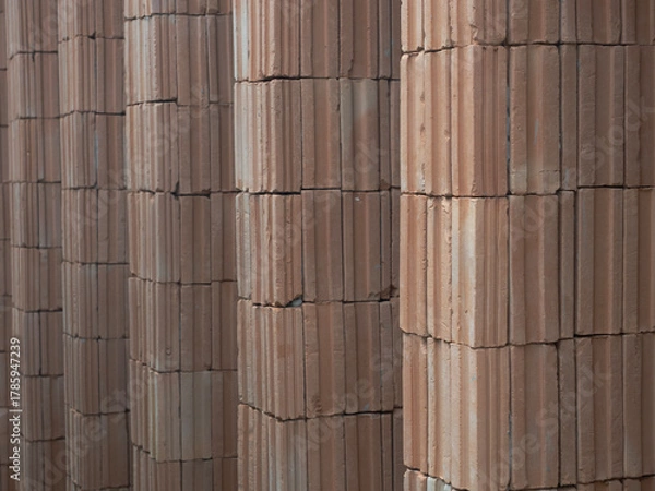 Fototapeta Red bricks for building in construction site for background.