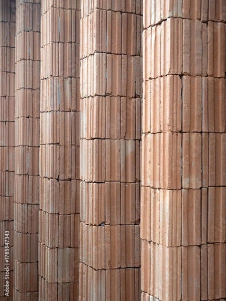 Fototapeta Red bricks for building in construction site for background.