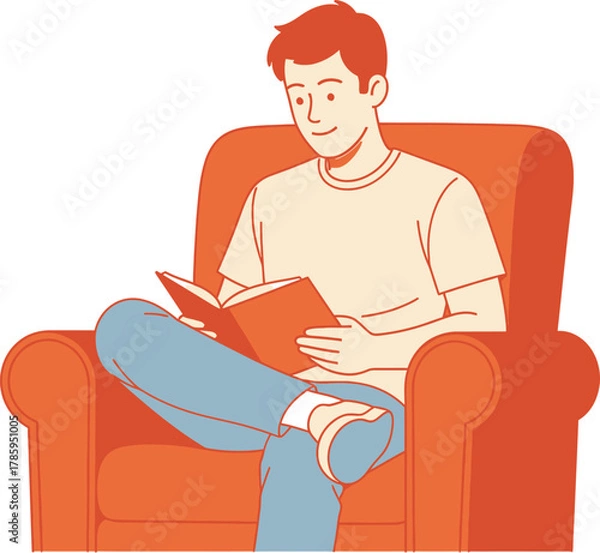 Fototapeta A young man is sitting in a comfortable armchair, engrossed in reading a book, creating a cozy and relaxed atmosphere