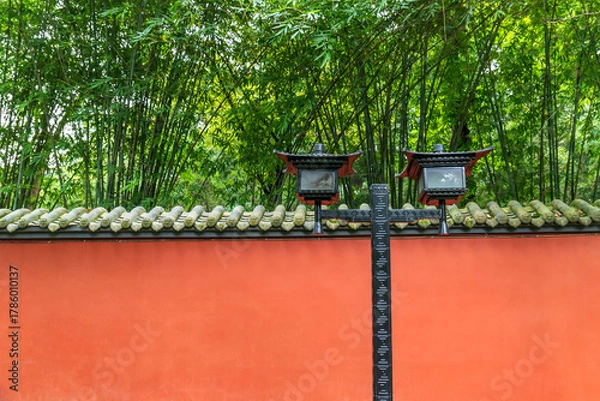 Fototapeta Street lamps in the background of the red courtyard wall of traditional Chinese architecture