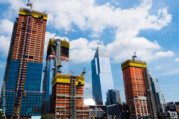 Fototapeta New York construction places. New buildings in process with Scaffolds