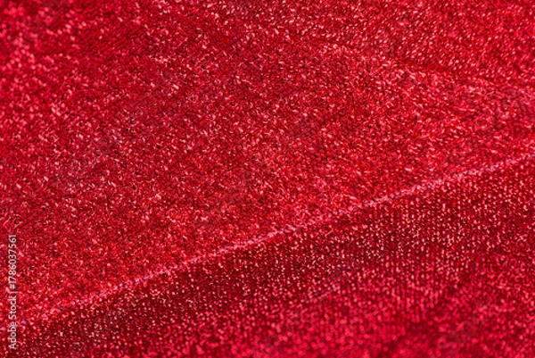 Fototapeta Red shiny blurred universal festive background. Brilliant colored sequins. Holiday greeting card. Happy holidays. Minimal, flat lay, copy space. Mockup