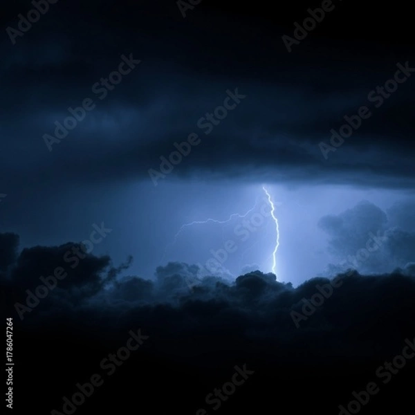 Fototapeta The night was dark, the sky was dark, the clouds were black, and the lightning flashed in a long line.