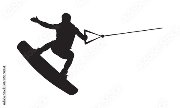 Obraz Wakeboarder performing a trick silhouette
